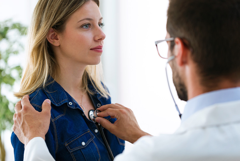 heart rate of a patient doctor listening to a patient's heartbeat